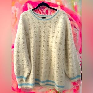 New Torrid fluffy sweater worn once. Size 3. Cozy, soft and luxurious.